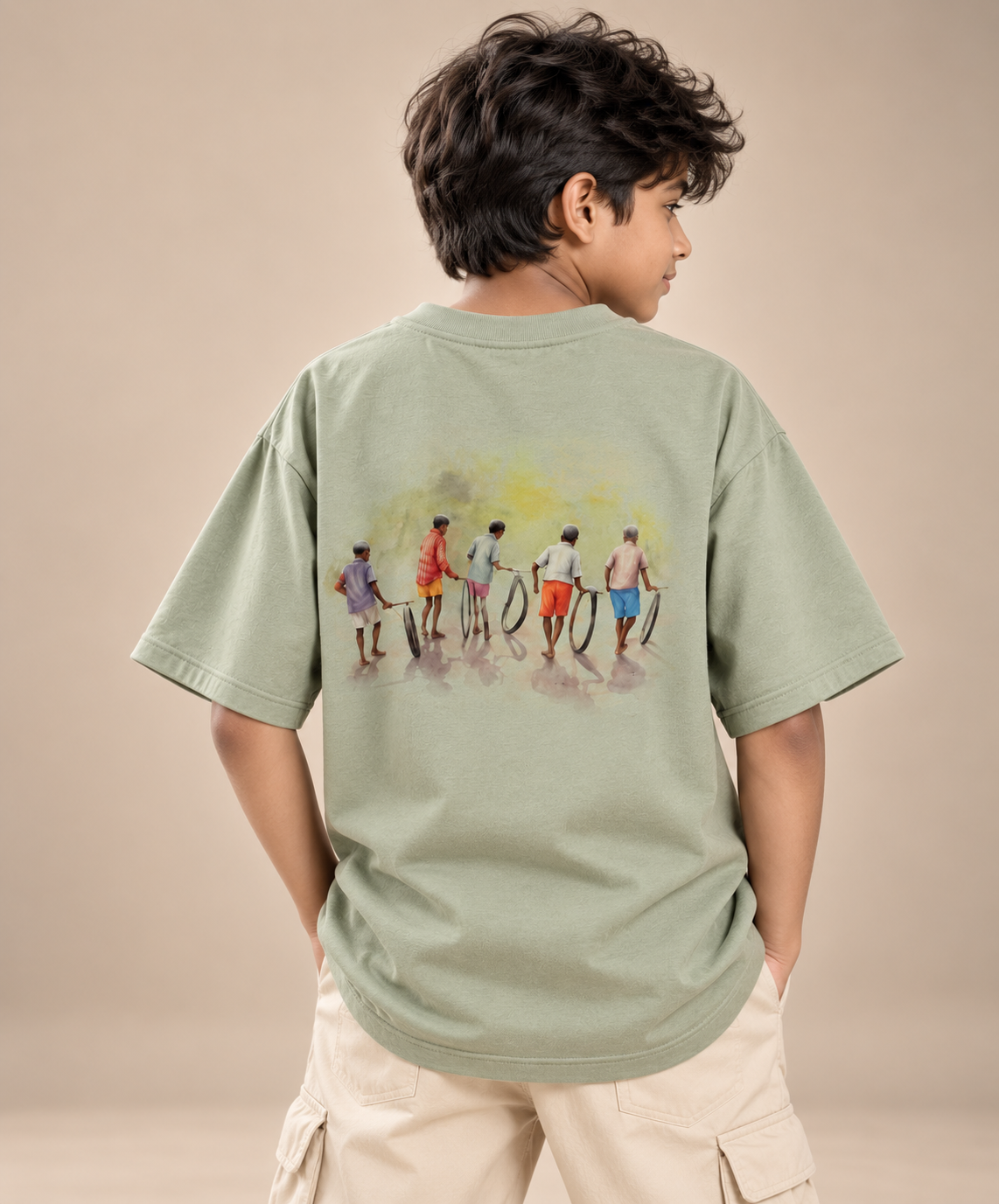 Boy wearing Chase the Sun kids & teens oversized cotton t-shirt in sage green
