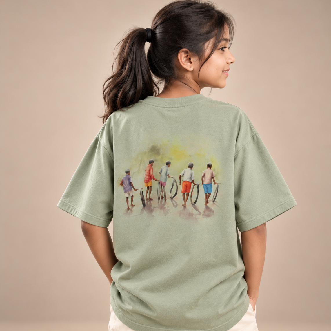 Girl wearing Chase the Sun kids & teens oversized cotton t-shirt in sage green